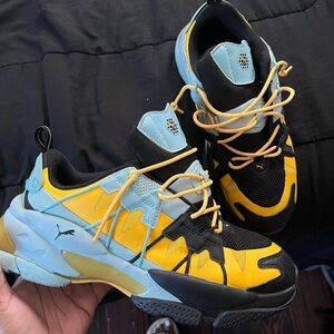 QDCELL Men’s Puma Omega Striped Knit Black & Ultra Yellow Sneakers